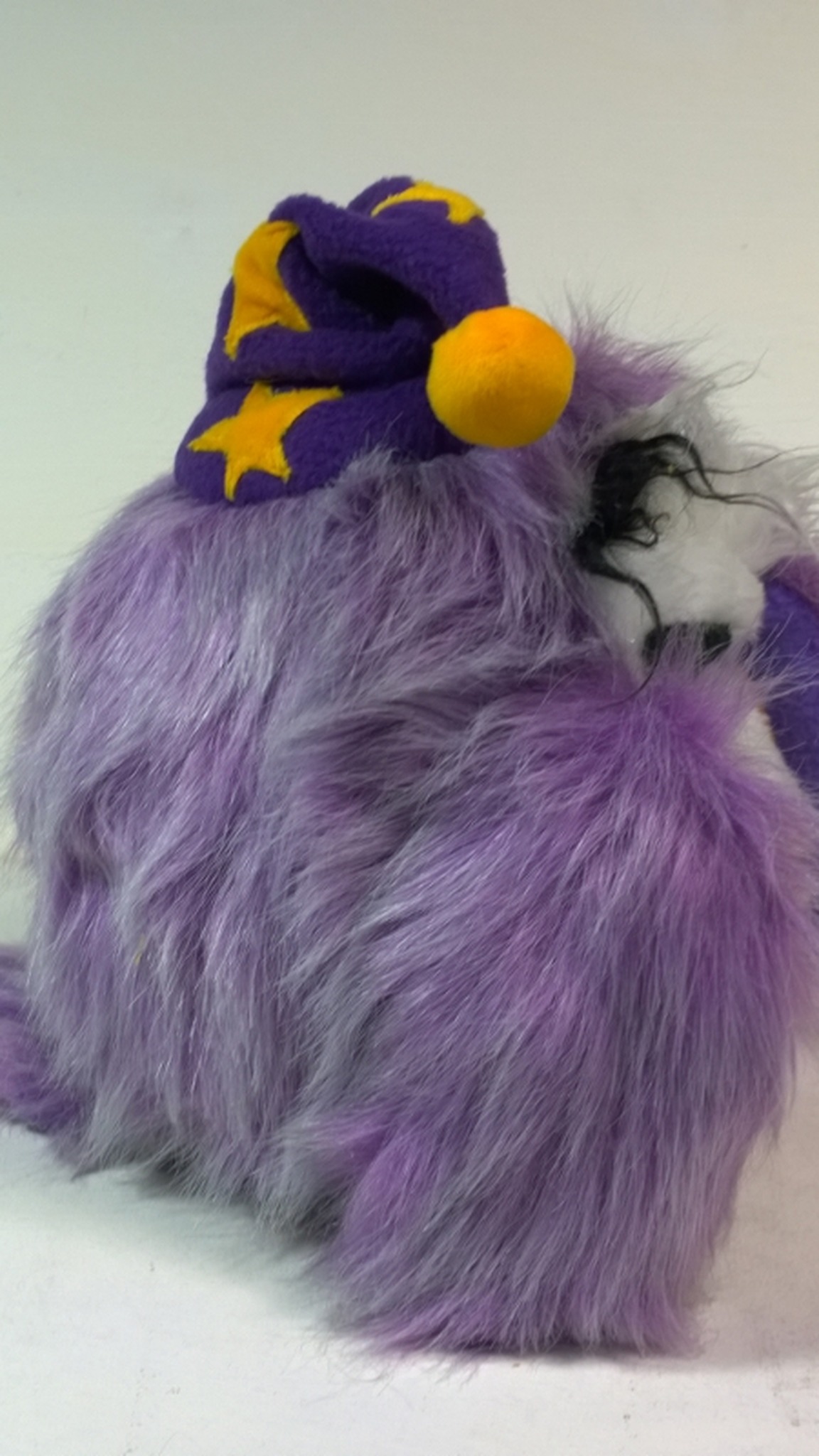 Sleepy owl stuffed animal with long lilac faux fur on its back and a starry nightcap, handmade to order