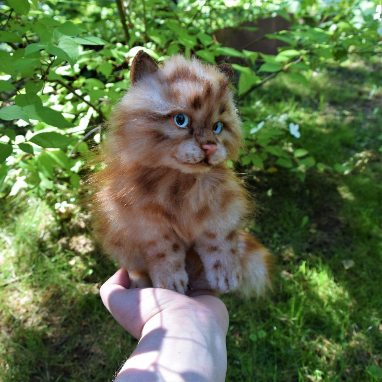 Small realistic kitten plush on a hand Small realistic kitten plush sitting on an open hand, ginger tabby faux fur, made to order