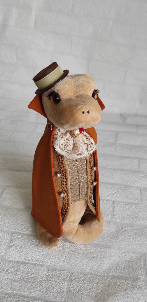 Snake plush gentleman with top hat Snake plush gentleman in an orange cape, lace jabot and small top hat, custom corporate gift made to order