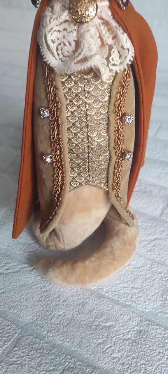 Snake plush with curled tail Custom snake plush in braided waistcoat, tail curled underneath so it stands, handmade corporate gift