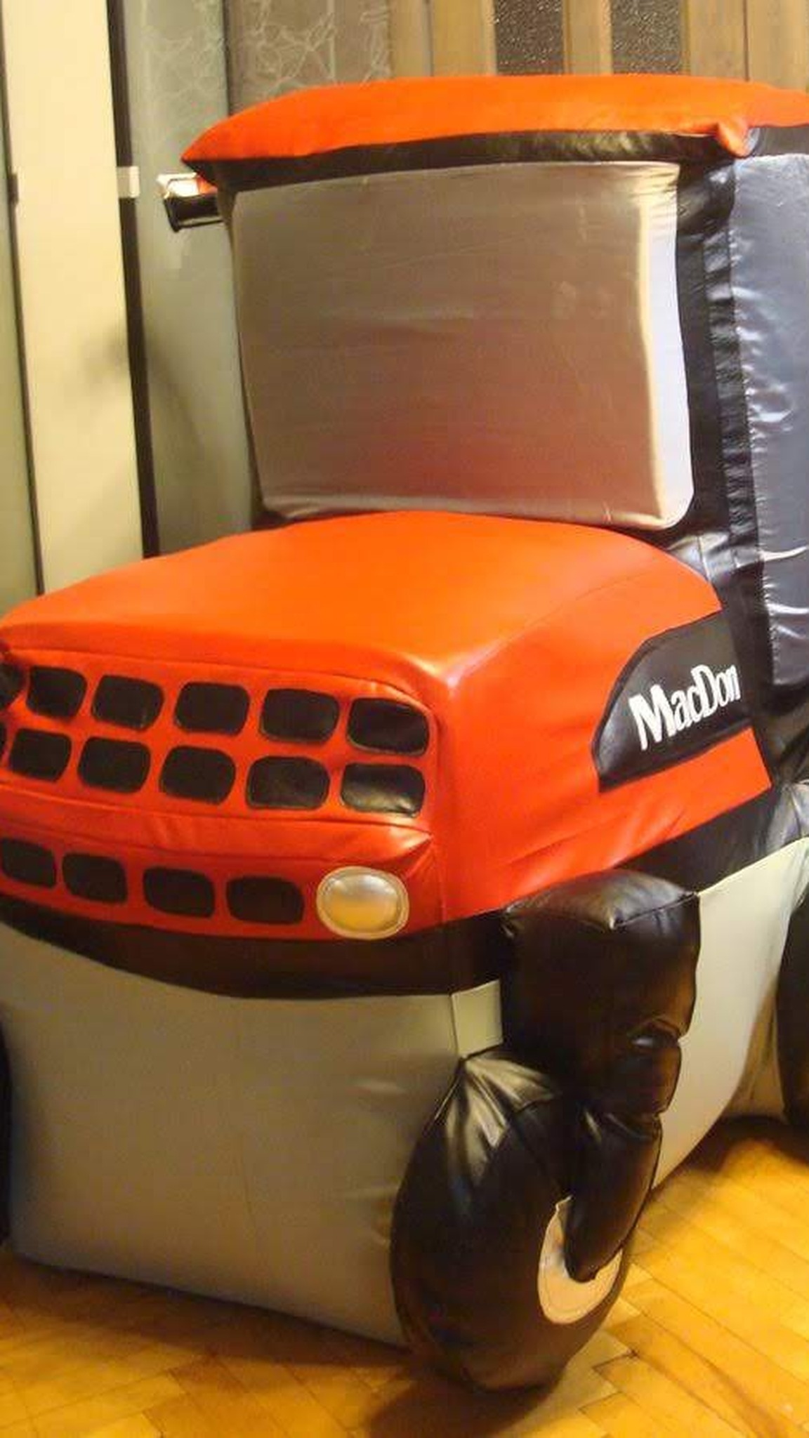Soft harvester model with a padded black grille, round headlight and silver cab, handmade to order