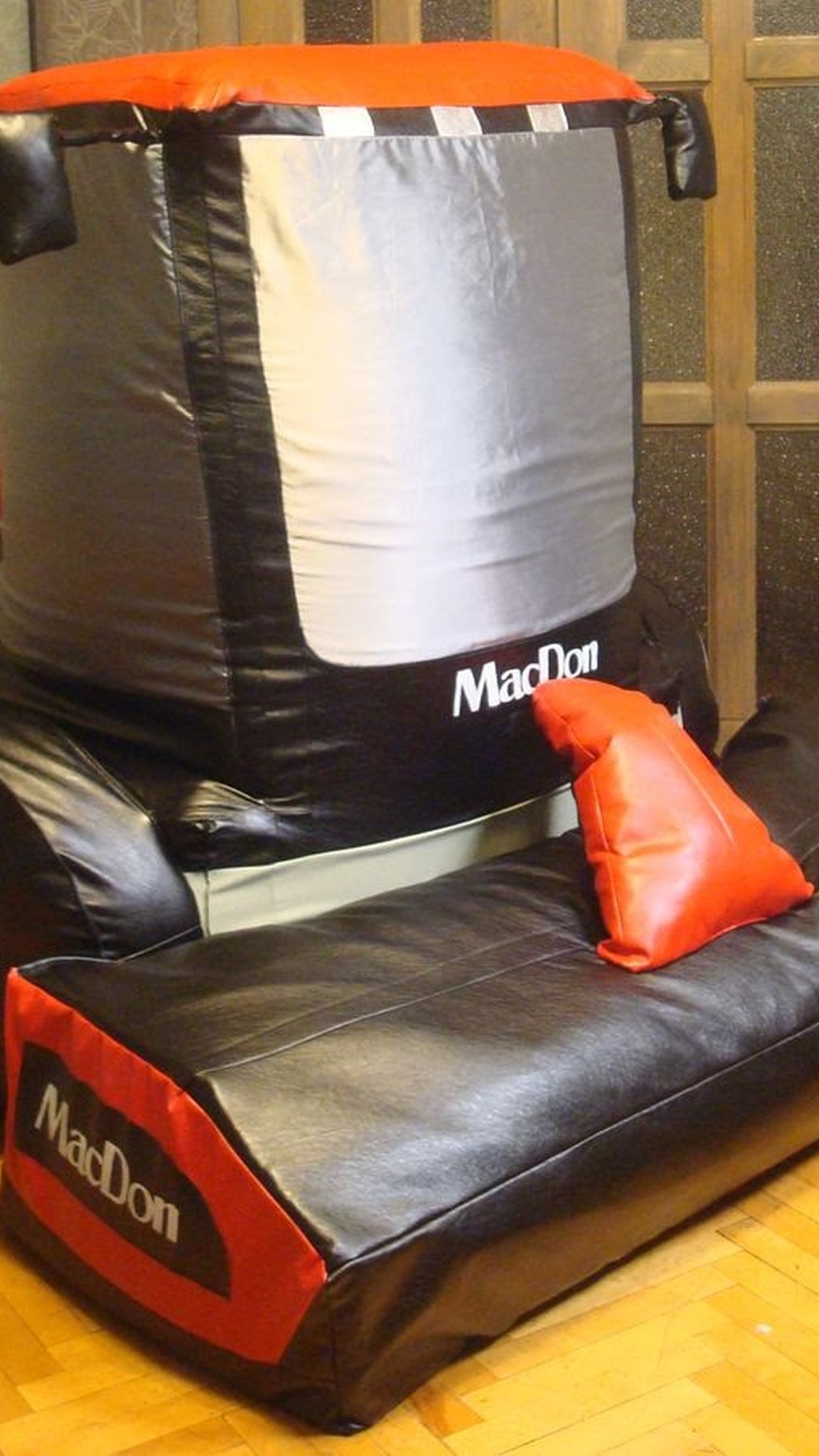Giant soft harvester with a low black and red header and tall silver cab, faux leather, made to order