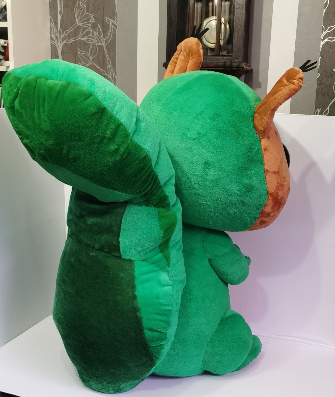 Squirrel mascot plush tail Big green tail of a squirrel mascot plush, two shades of green plush, sewn to order for a trade show booth
