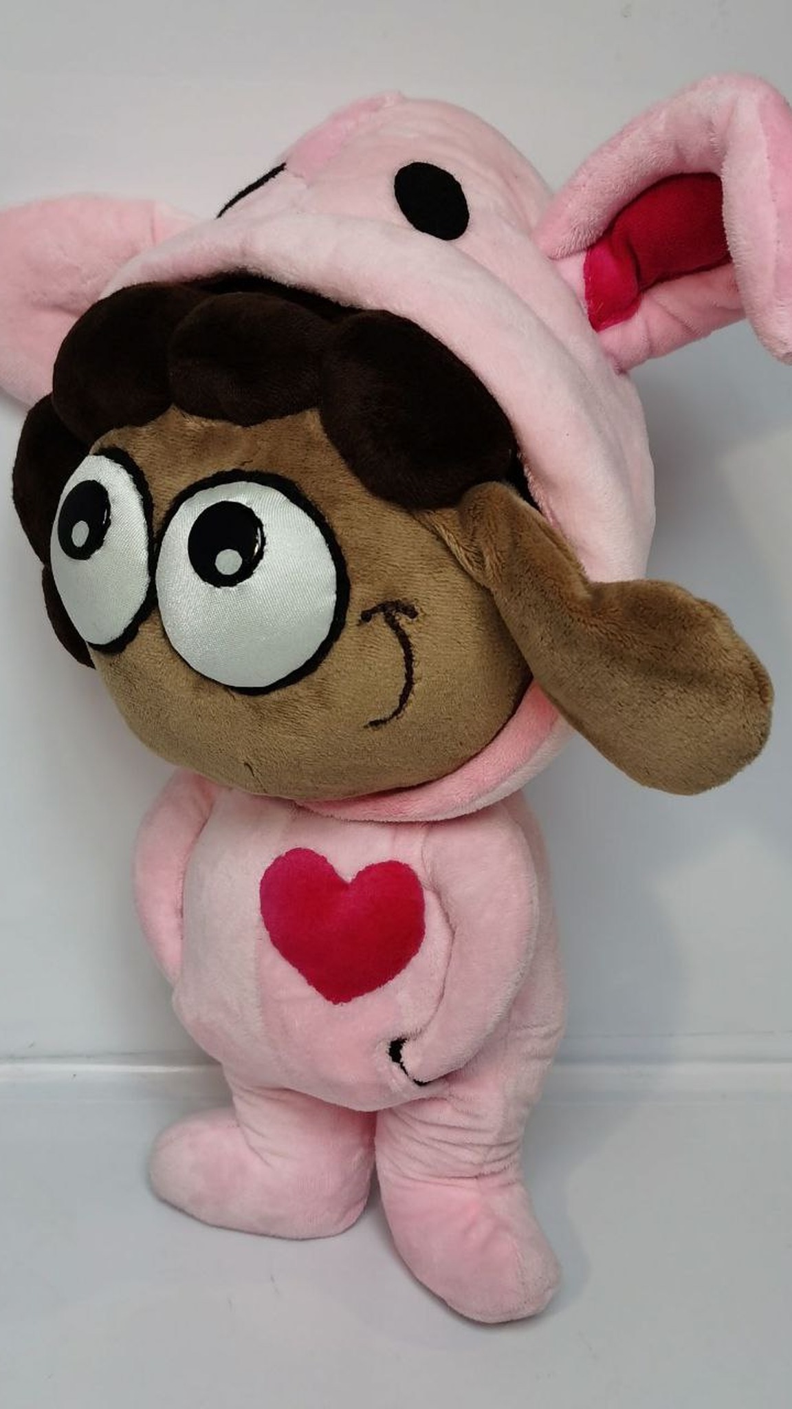 Sticker plush sheep with a sideways smile, pink bunny-ear onesie and red heart, handmade to order