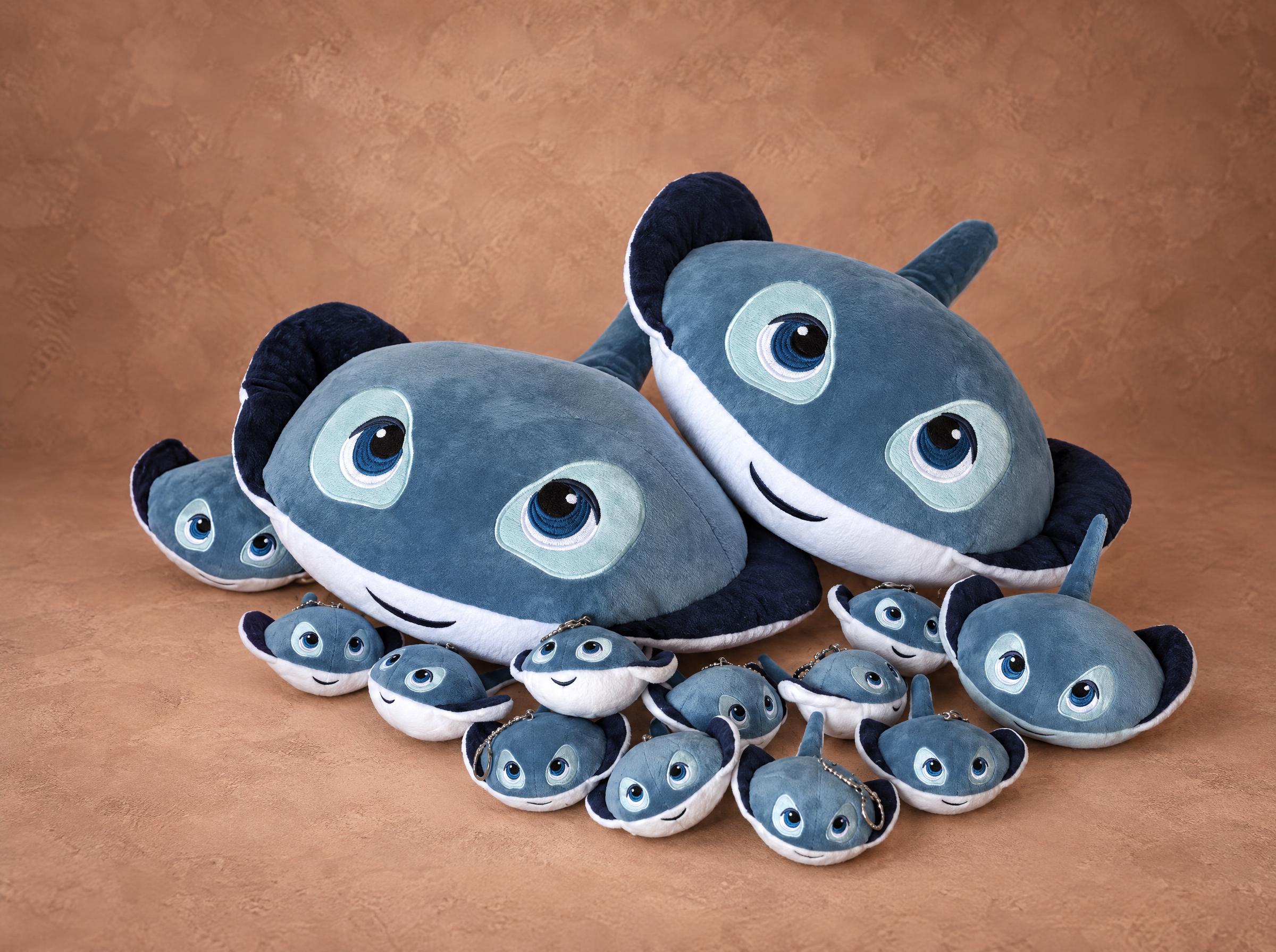 Custom stingray plush keychains and big ray pillows with embroidered blue eyes, made to order for a company