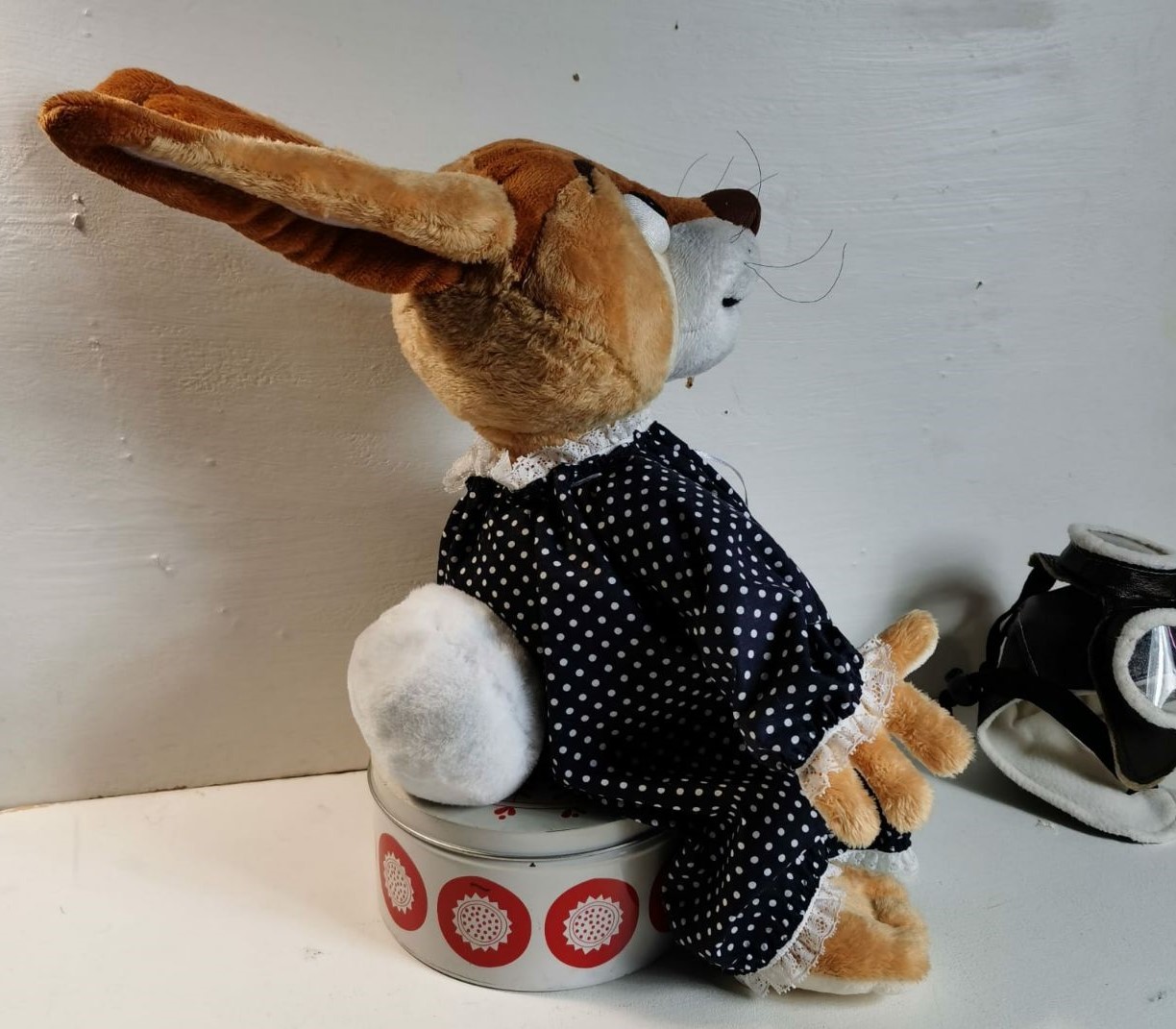 Storybook bunny plush with the cap off Storybook bunny plush in a polka-dot dress with her aviator cap off, long tan ears, handmade to order