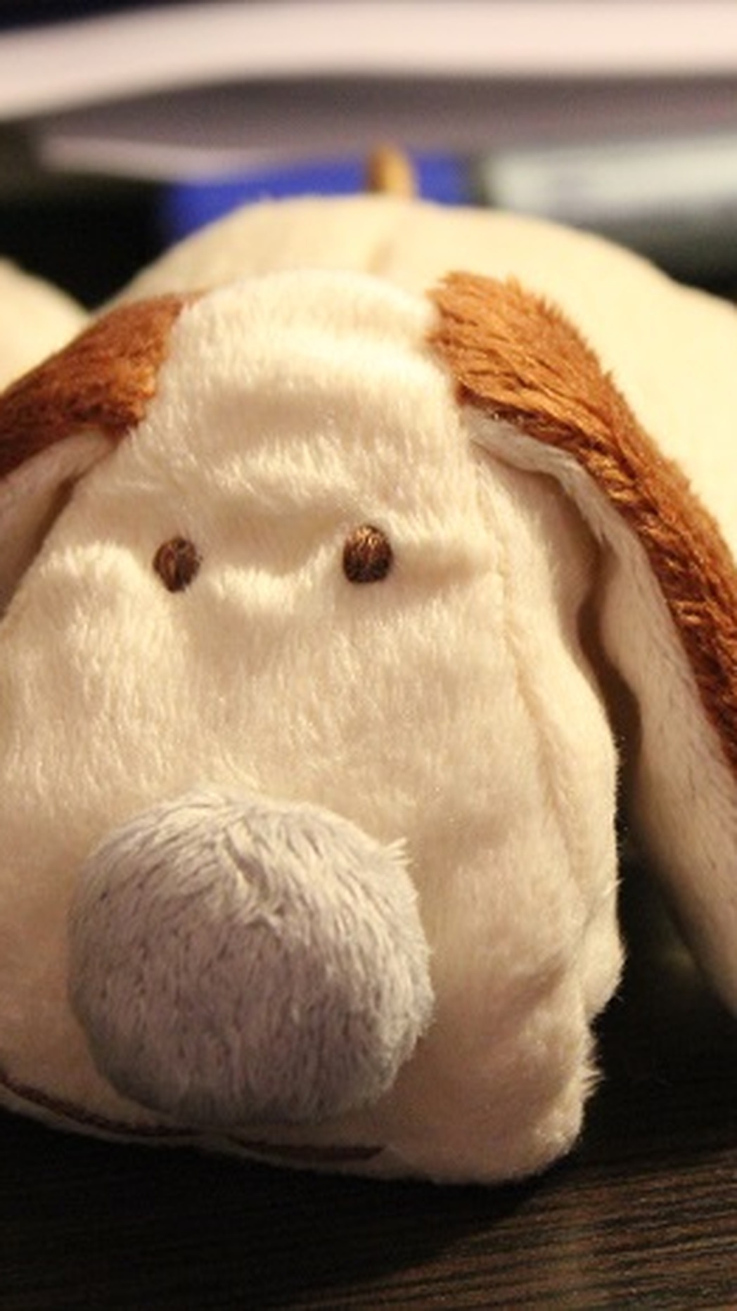 Duplicate stuffed dog with brown faux fur ears and a grey nose, a smaller copy made to order