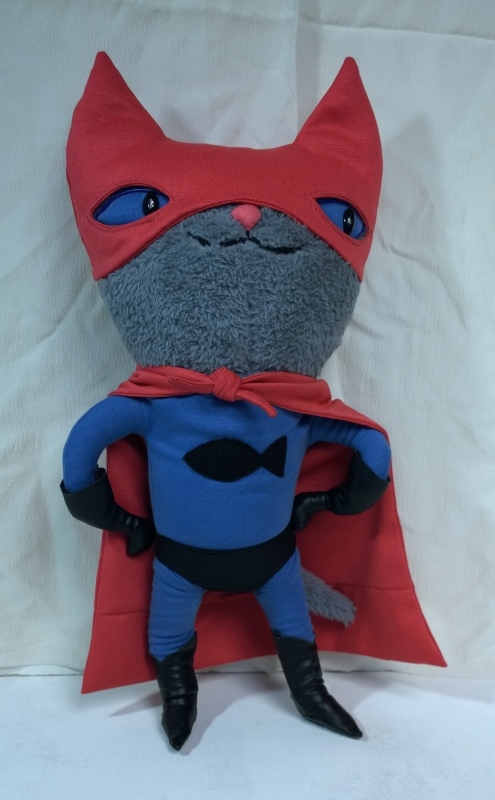 Superhero cat plush with fish emblem Superhero cat plush with blue eyes behind a red mask and a black fish emblem on a blue suit, made to order