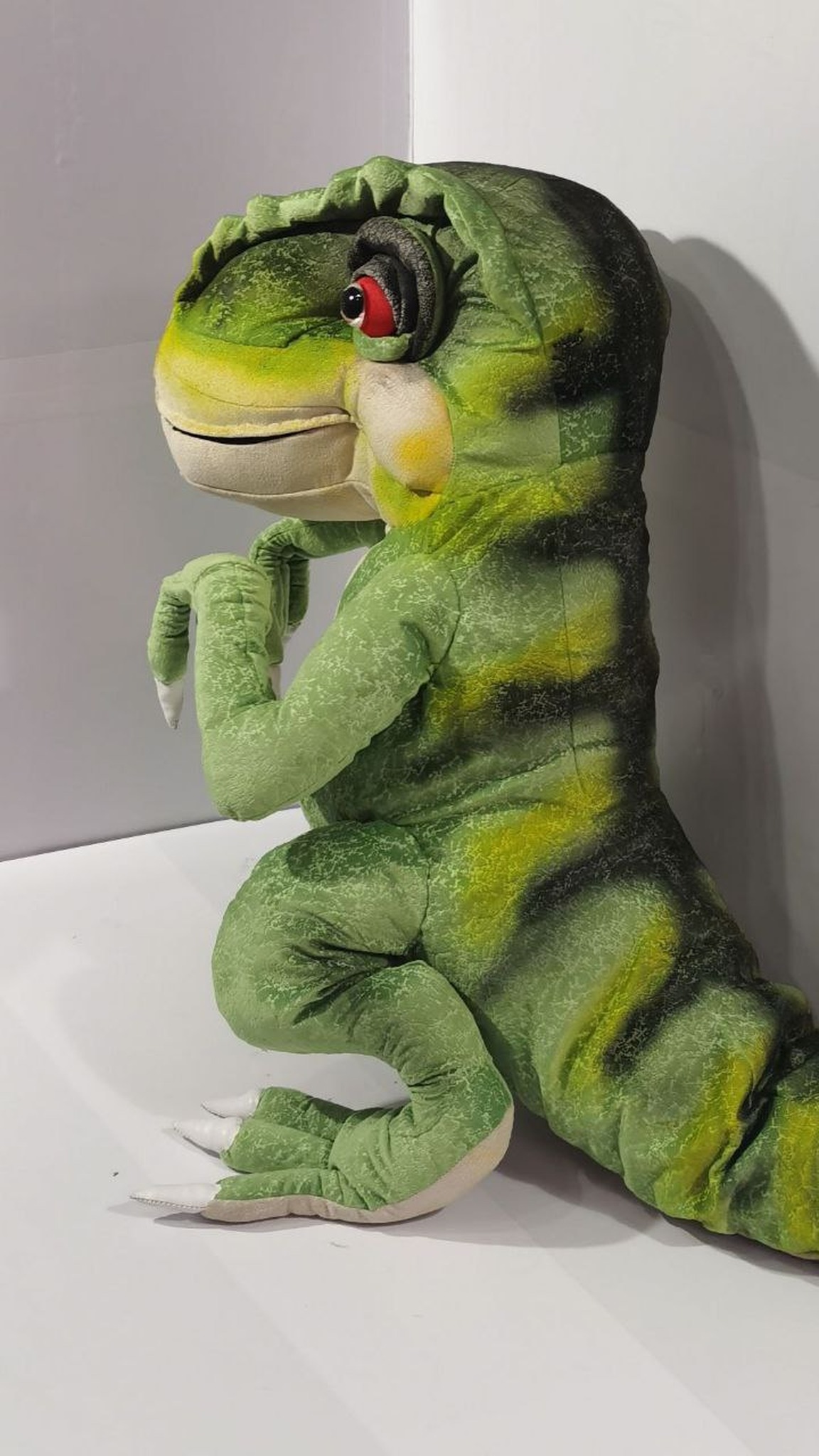 Green T-rex plush with yellow and dark stripes down the back and tail, sewn by hand to order