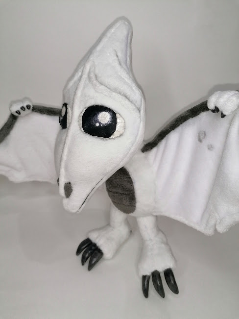 Tamagotchi pet plush with black claws Handmade tamagotchi pet plush with glossy black eyes, grey belly patch and black claws, custom made