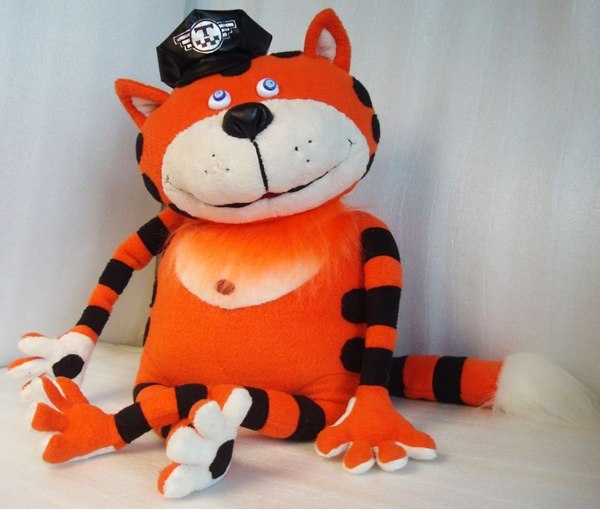 Taxi cat plush sewn from a drawing Taxi cat plush sewn from a drawing: orange striped cat with button eyes, cream muzzle and a taxi badge cap