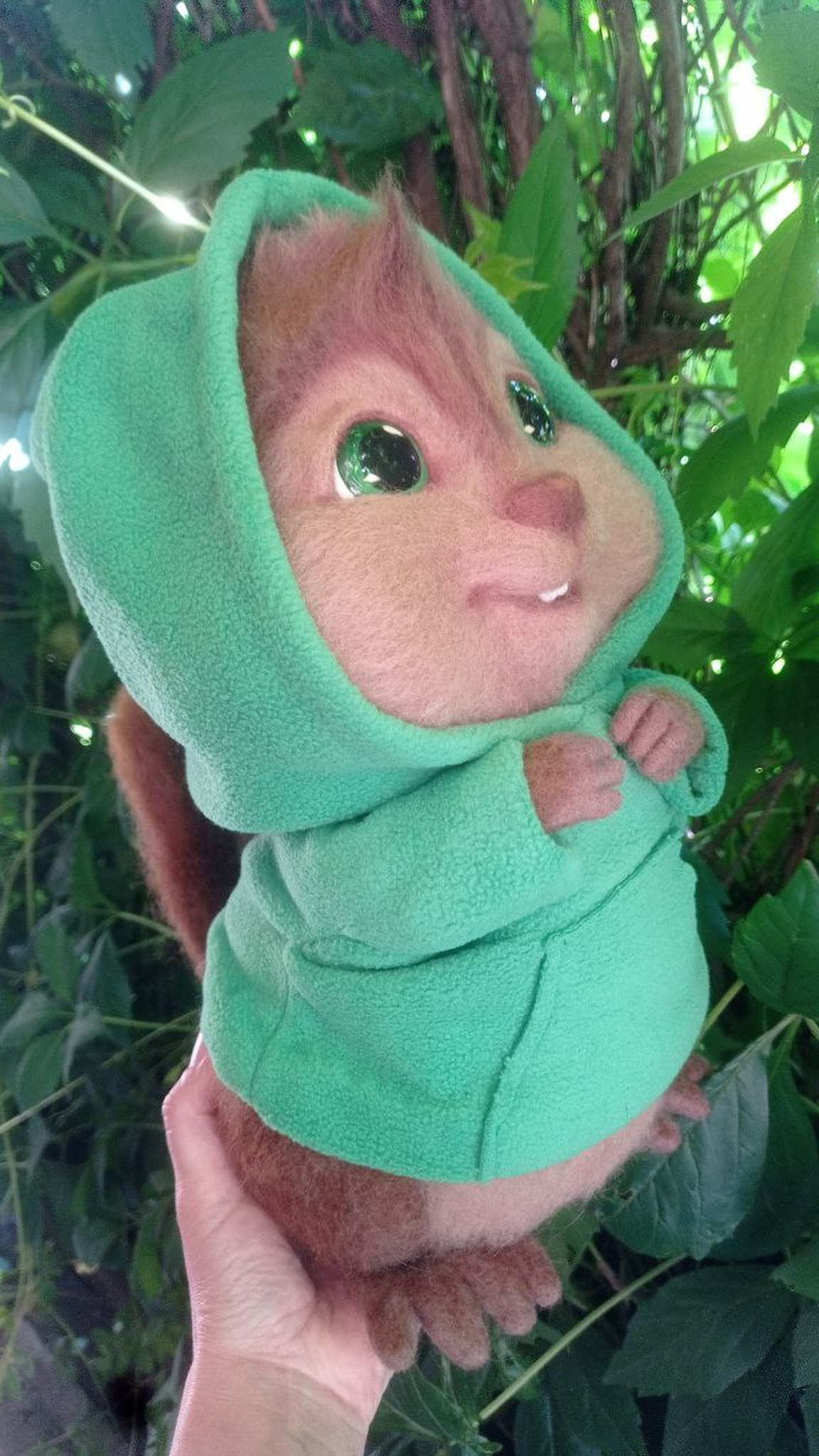 Theodore chipmunk plush in a green hood with his wool tail showing, custom needle felted fan toy to order