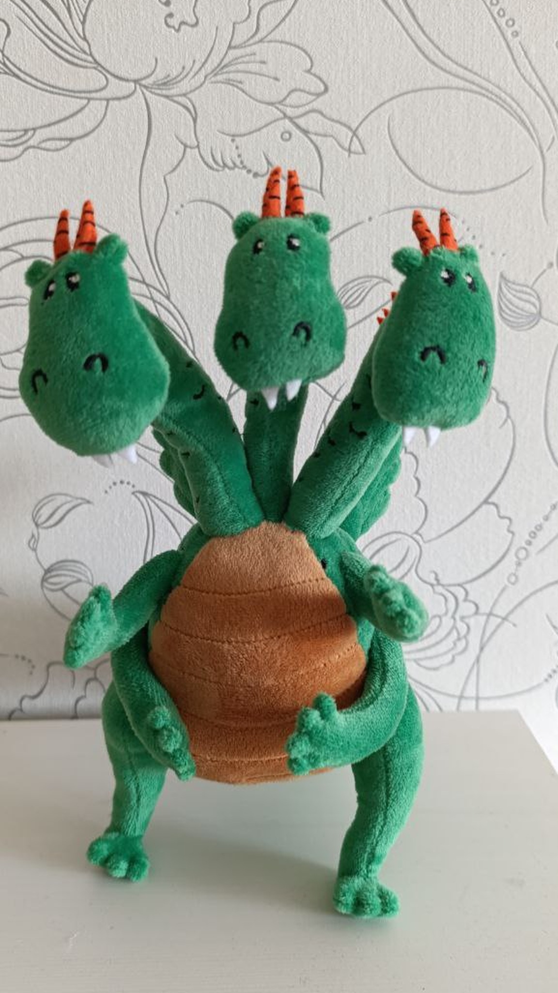 Green three-headed dragon plush with orange horns and a tan belly, custom dragon toy sewn by hand to order