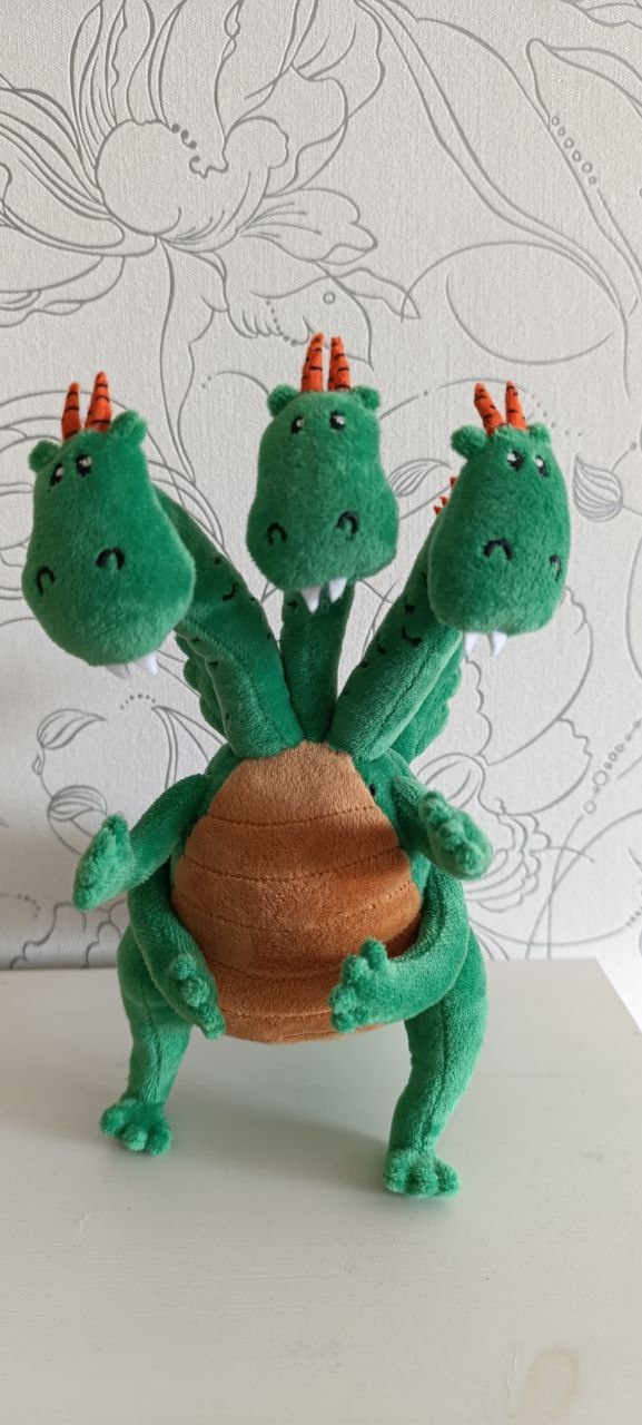 Three-headed dragon plush with tan belly Green three-headed dragon plush with a round tan belly and orange horns, a custom dragon toy made to order