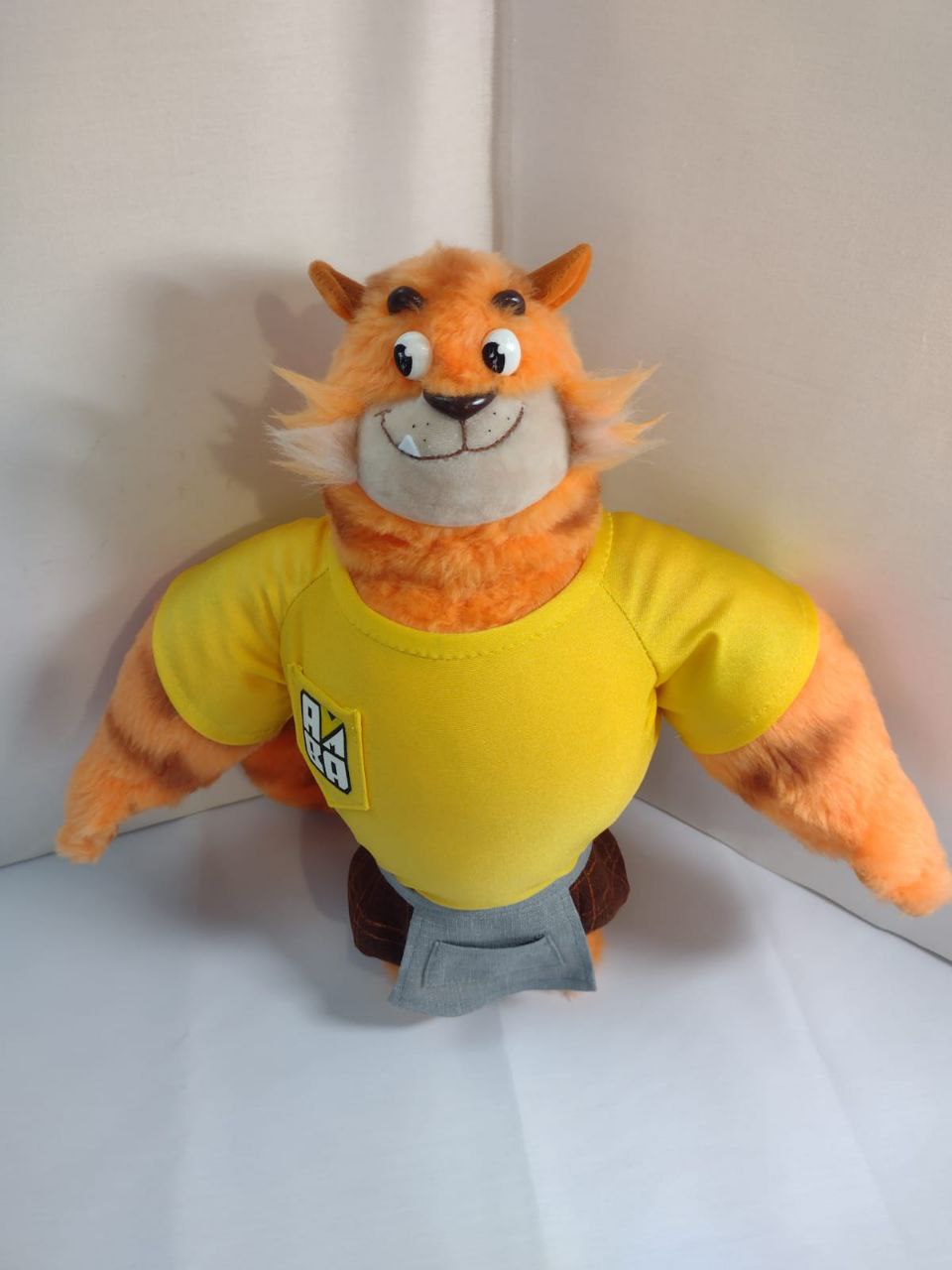 Tiger mascot plush in a yellow T-shirt Tiger mascot plush: striped orange cat in a yellow T-shirt with an embroidered logo, handmade to order