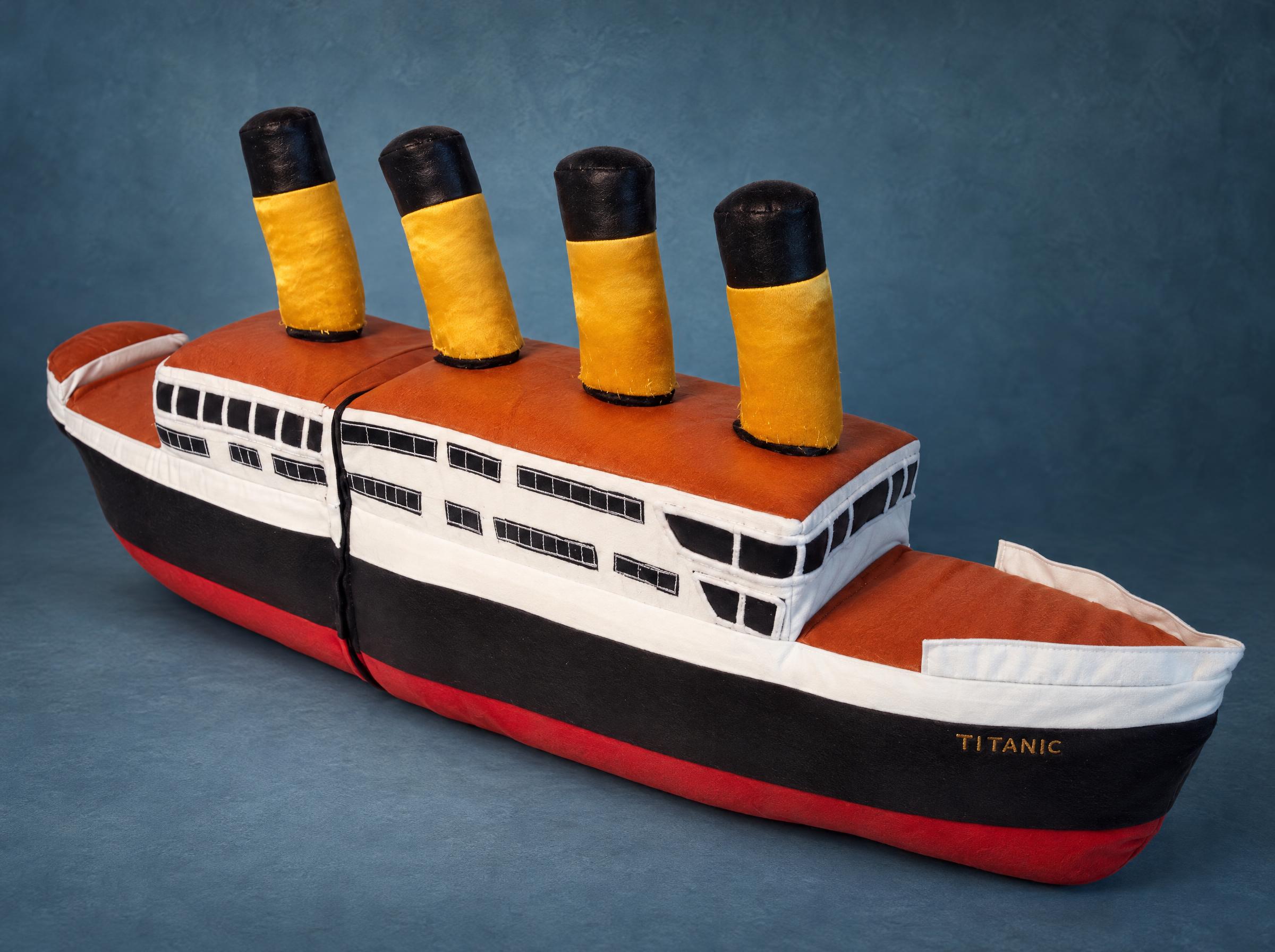 Titanic stuffed toy ship with four yellow funnels, black and red hull and the name on the bow, handmade to order