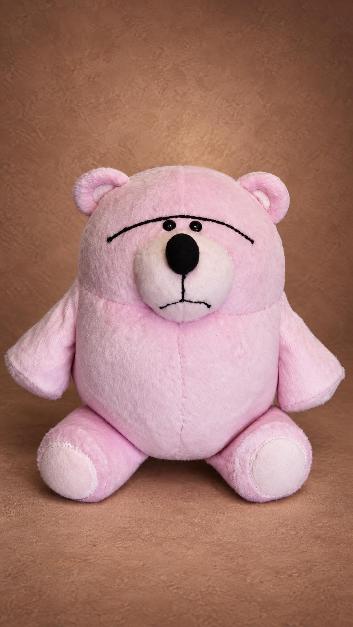 Custom Fur Bear plush from Toy Story sitting up on his own, pale pink with cream foot pads, made to order