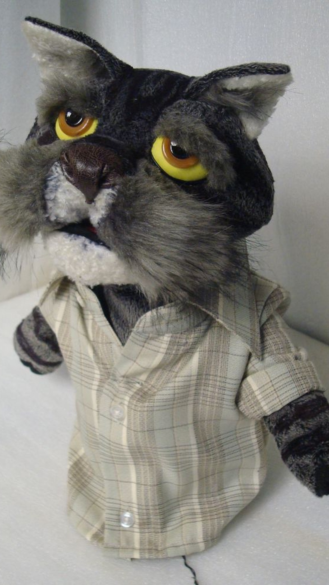 TV puppet of a grey tabby cat dad in a checked shirt, custom hand puppet sewn to order for a series