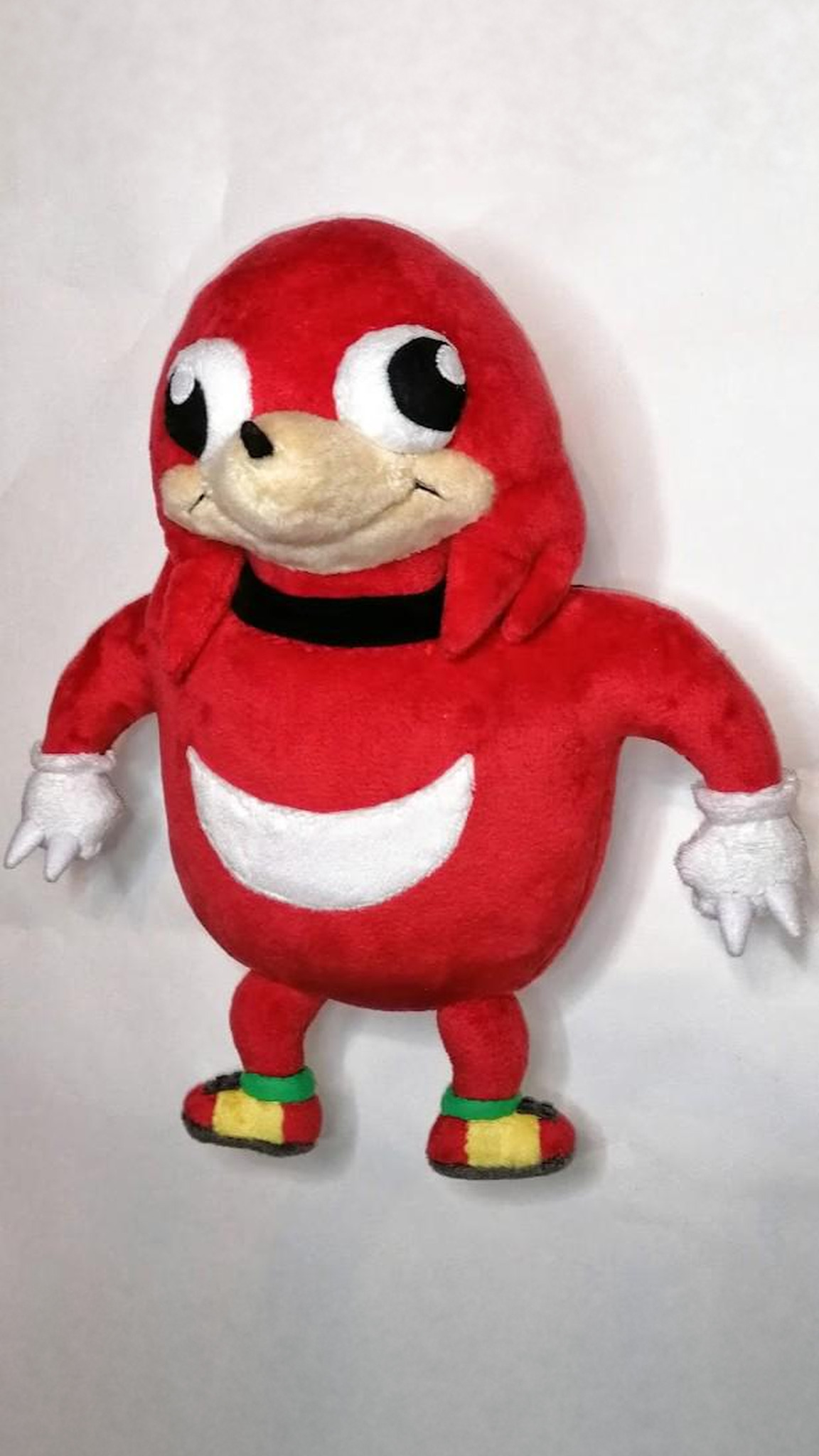 Ugandan Knuckles plush with big round eyes, tan muzzle and a smirk, red meme Knuckles made to order