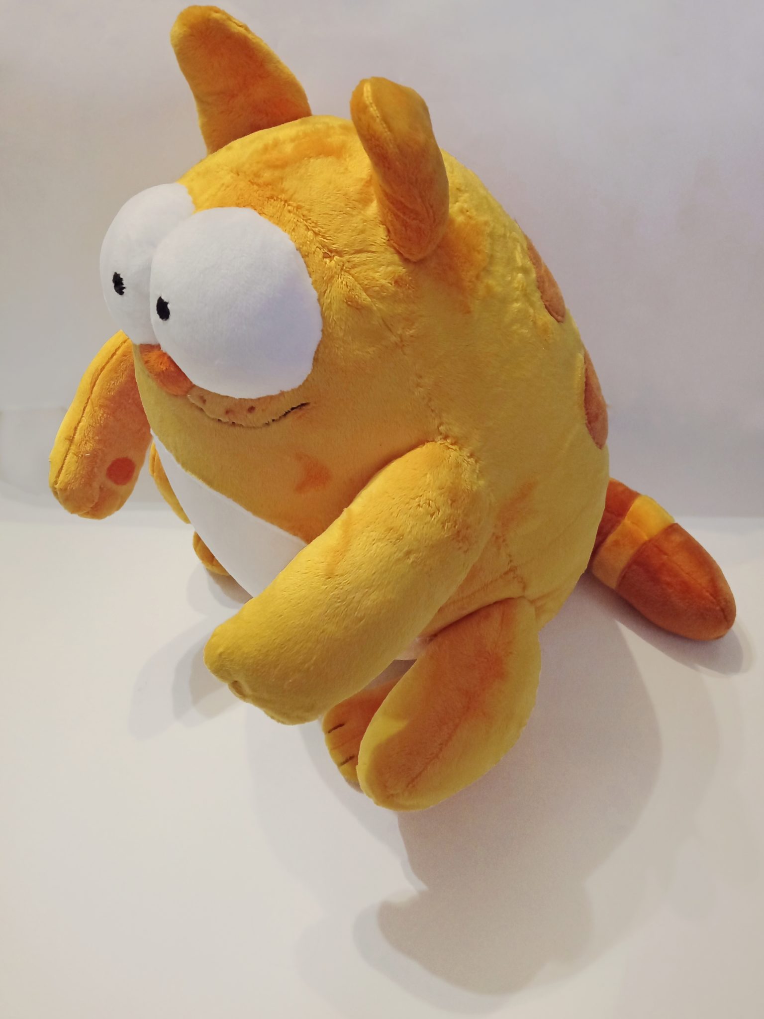 Viber cat plush with pointy ears Custom Viber cat plush with a tilted head, pointy ears and a striped tail, sticker toy made to order