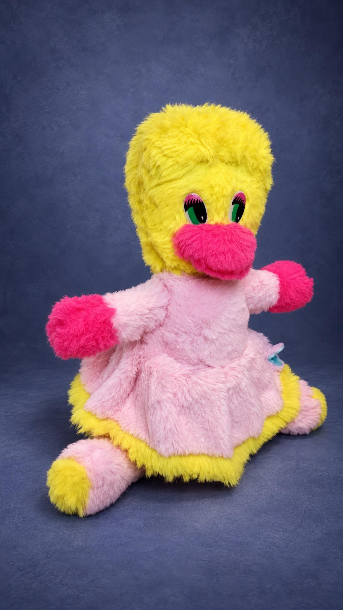 Custom Webby plush from DuckTales, a childhood toy sewn again by hand: green lashed eyes, pink beak