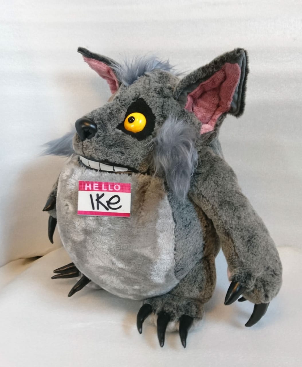 Werewolf-style plush Ike with a wide grin Werewolf-style plush Ike: pointed pink-lined ears, blue-grey fur tufts and a wide grin, made to order