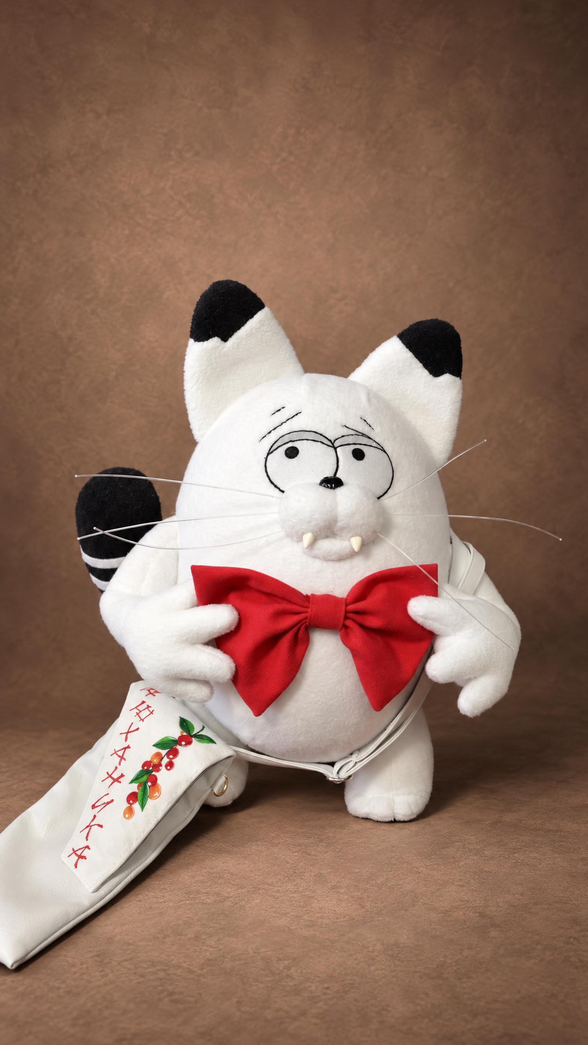 Handmade white cat plush Kokos holding a big red bow tie, black ear tips and striped tail, sewn to order