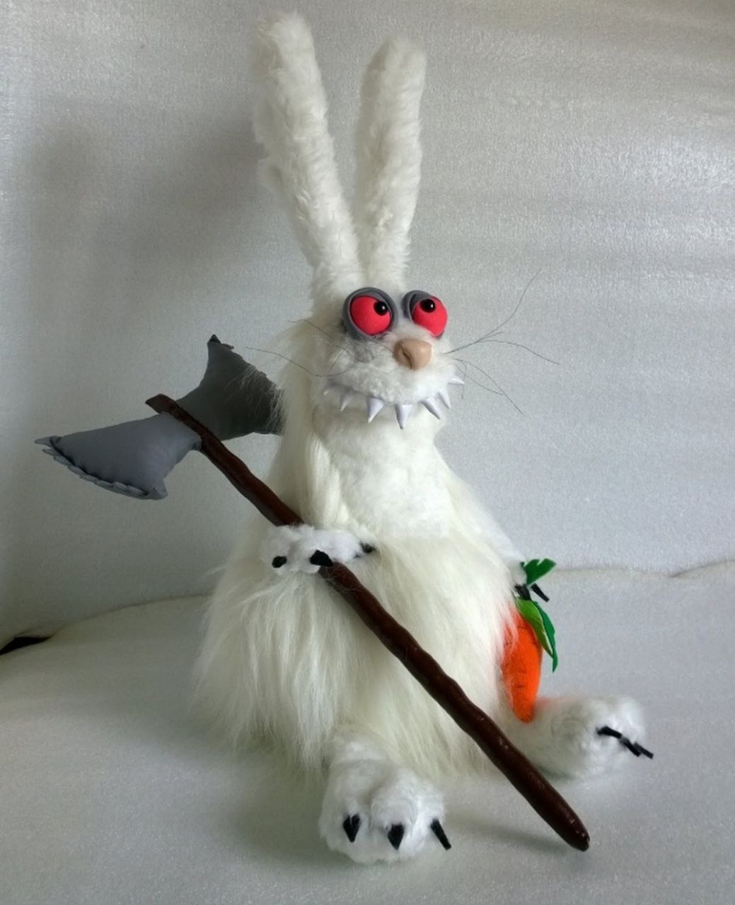 White rabbit plush with red eyes White rabbit plush with red eyes and fangs, made to order from a drawing: black claws, axe and orange carrot