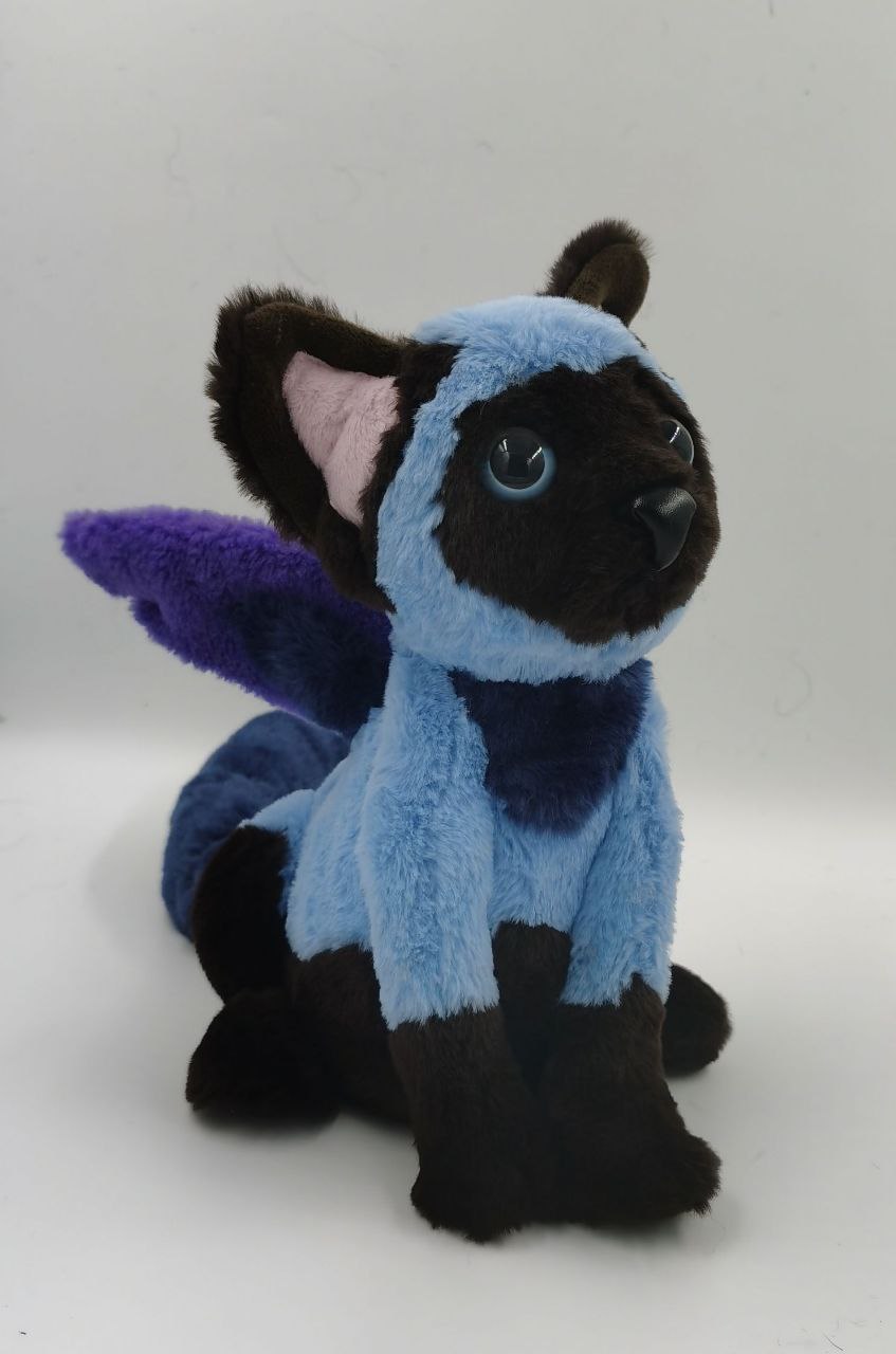 Winged cat plush with blue eyes Blue winged cat plush with glossy blue eyes, a black nose and purple wings, a custom OC plush made to order