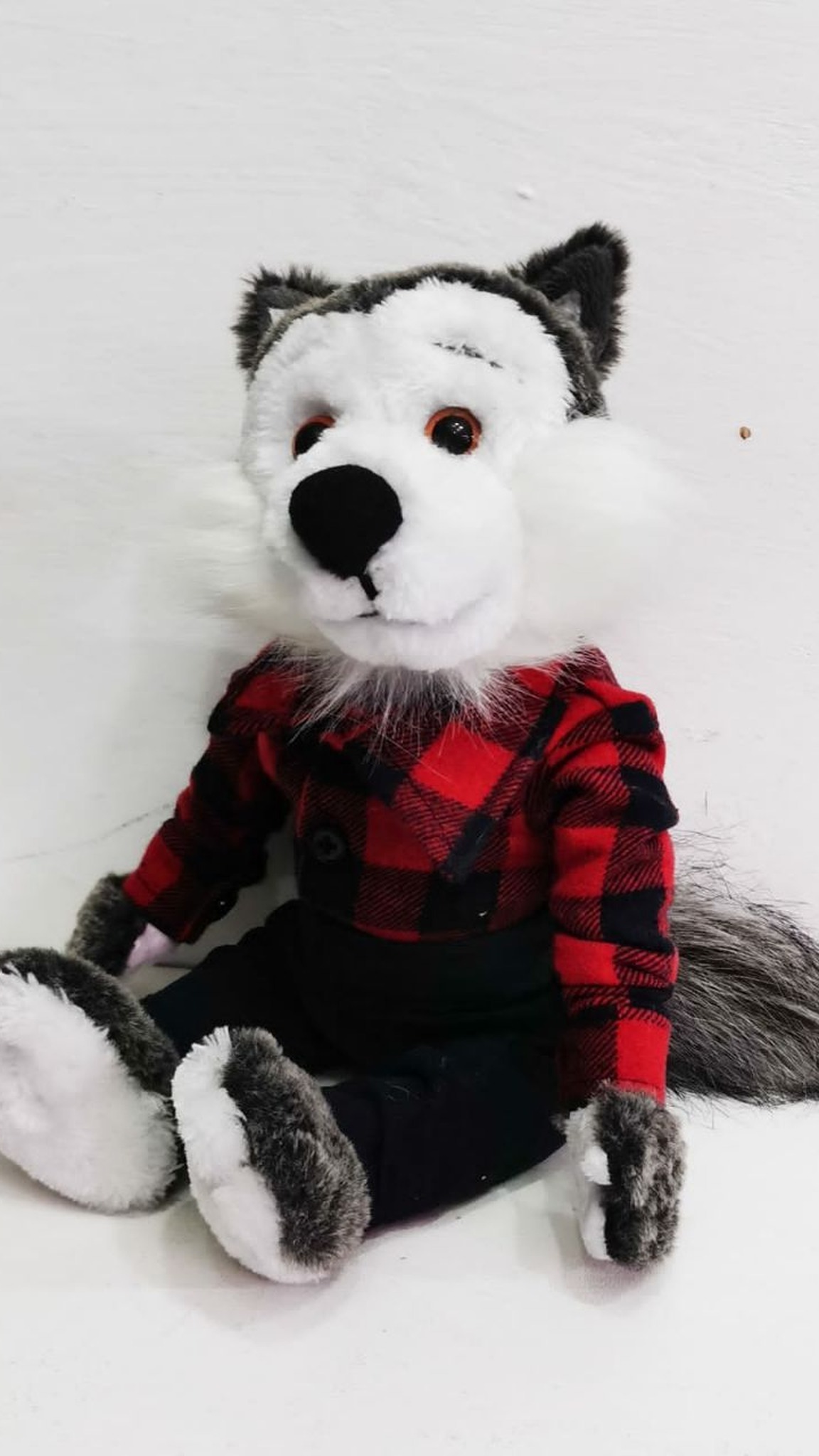 Childhood wolf plush replica sitting with its bushy tail out, grey and white faux fur, made to order