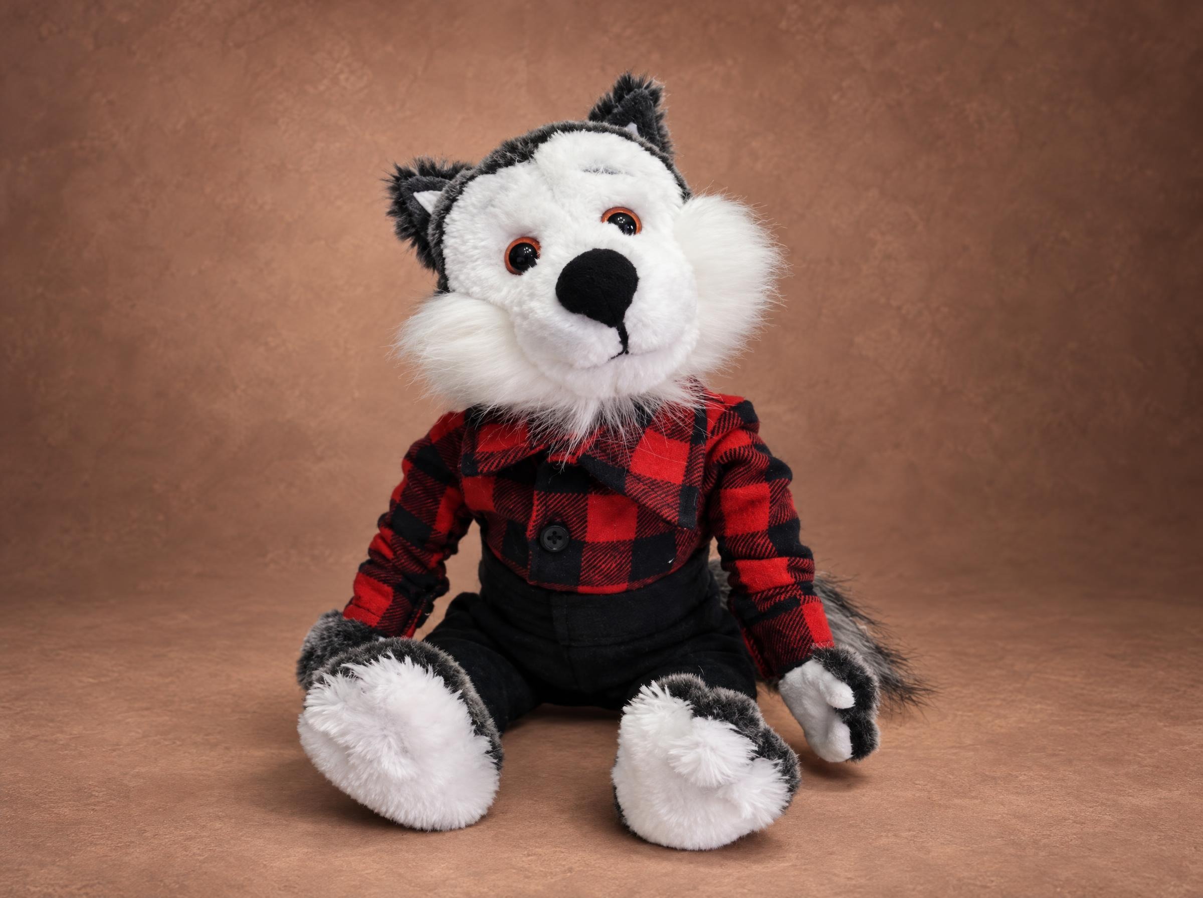 Wolf stuffed animal in a red buffalo check shirt, a childhood toy recreated by hand to order from an old photo