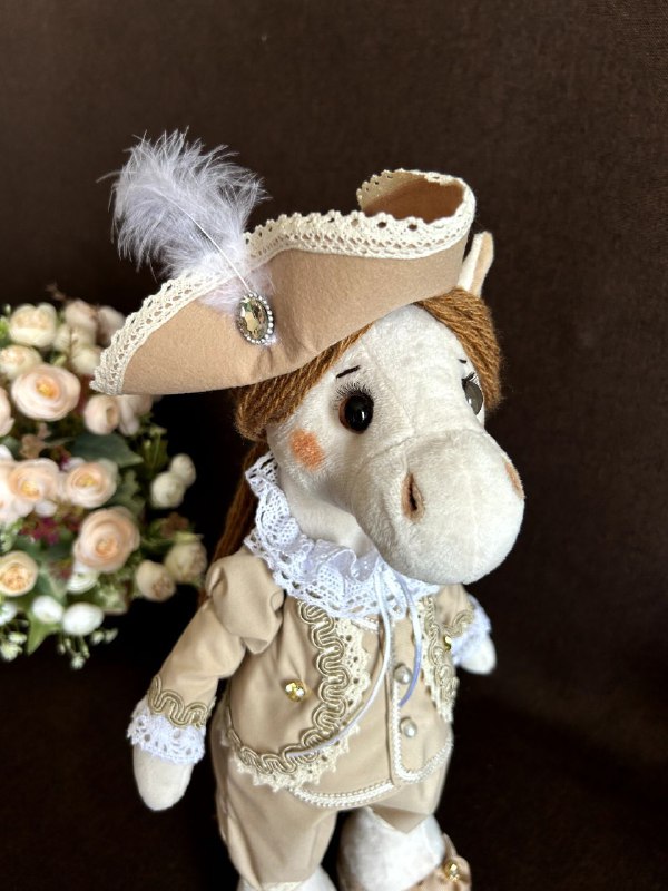 Year of the Horse plush stallion Year of the Horse plush stallion with a cream face, pink cheeks and a feathered hat, sewn to order