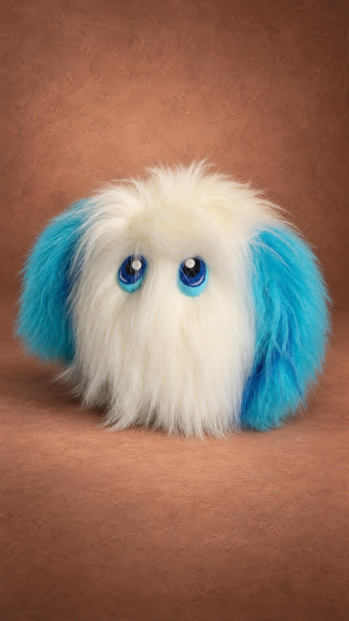 Round white furry monster plush Zdorovye with turquoise faux fur ears and blue eyes, custom made to order